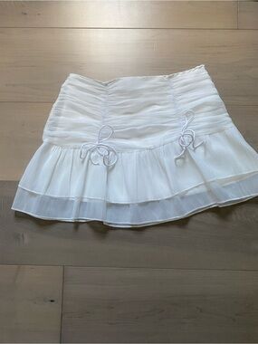 White Ruffle Mini Skirt with Side Bow Accents